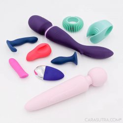 Selection of vibrators and sex toys arranged on a white background.