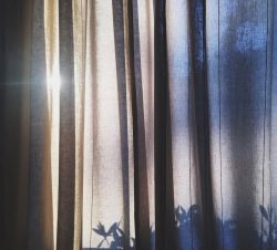 curtains closed against the sunlight in a heatwave