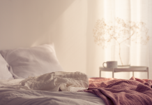 Gentle bedroom scene reflecting concept of pain during sex, the causes and how to fix it