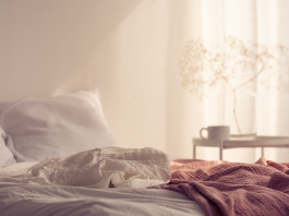 Gentle bedroom scene reflecting concept of pain during sex, the causes and how to fix it