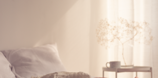 Gentle bedroom scene reflecting concept of pain during sex, the causes and how to fix it