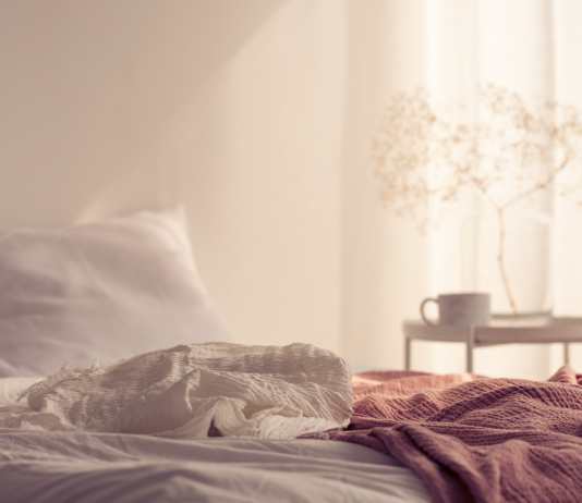 Pain During Sex: Why Painful Intercourse Happens And How To Fix It Gentle bedroom scene reflecting concept of pain during sex, the causes and how to fix it