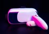The Rise and Impact of Interactive Sex Toys Worldwide Virtual reality headset and controllers representing interactive sex toys and digital intimacy technology