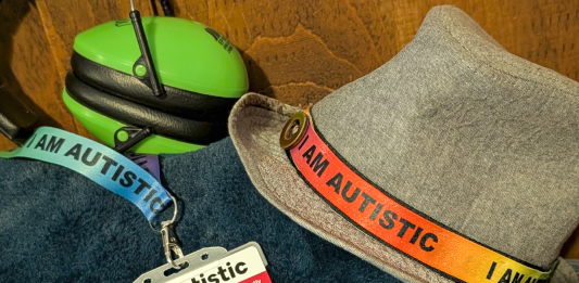 Parenting in a Neurodivergent Household: A Mother’s Reflection Ear defenders, an “I am autistic” lanyard and autism identification card used by a neurodivergent teenager.