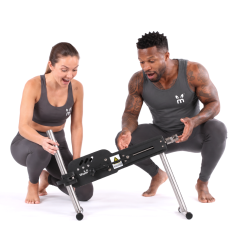 Thumpr A5 COMPACT sex machine held by man and woman models in stock photo with white background