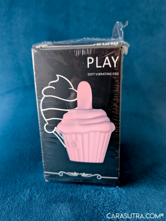 GITM Playbook Cupcake Vibrator box in original cellophane wrapping, showing the front of the black PLAY packaging on blue velvet