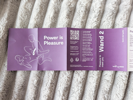 We-Vibe Wand 2 quick start guide unfolded showing the Power is Pleasure cover, QR code and product information