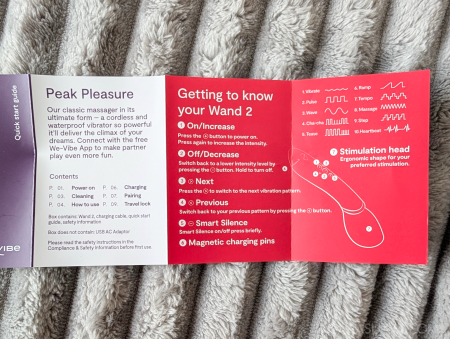 We-Vibe Wand 2 quick start guide showing the Peak Pleasure introduction and button function labels including On/Increase, Off/Decrease, Next, Previous, Smart Silence and Magnetic charging pins