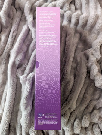 Side of the We-Vibe Wand 2 packaging showing product description and Bluetooth compatibility information
