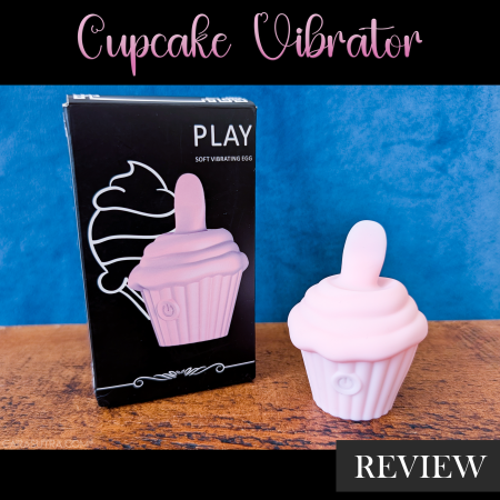 GITM Playbook Cupcake Vibrator review featured image showing the pink silicone cupcake-shaped vibrator beside its black PLAY box on a wood surface