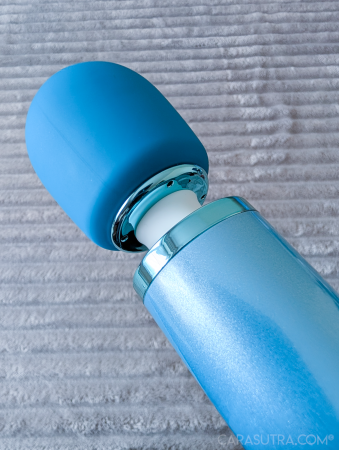 Angled close-up of the Le Wand Dive head joint, highlighting the chrome ring, white silicone collar and body-safe silicone head