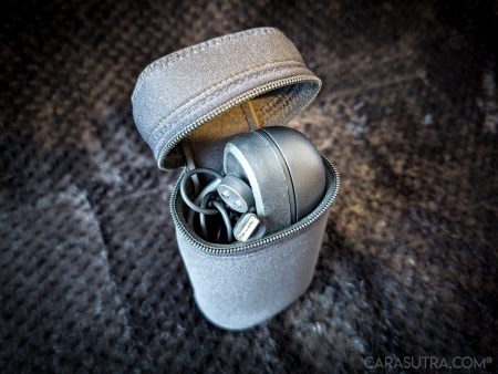 Arcwave Ion 2 black neoprene zip case open with the stroker and charging wire tucked inside