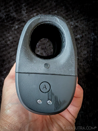 Arcwave Ion 2 held up to show the sleeve opening from above, with the magnetic connectors for charging and the Arcwave logo visible