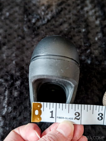 Arcwave Ion 2 body photographed on a black blanket beside a tape measure for scale