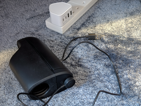 Arcwave Ion 2 magnetic charging cable connected to the device while it charges