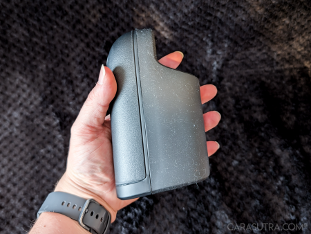 Arcwave Ion 2 gripped in hand, side view of the matte black body and sleeve area