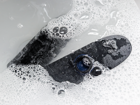Arcwave Ion 2 submerged in soapy water being cleaned, demonstrating its fully waterproof design