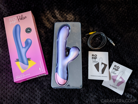 Everything included with the ROMP Pulse Rabbit Vibrator: the toy in its moulded cradle, the box, USB charging cable and instruction leaflets